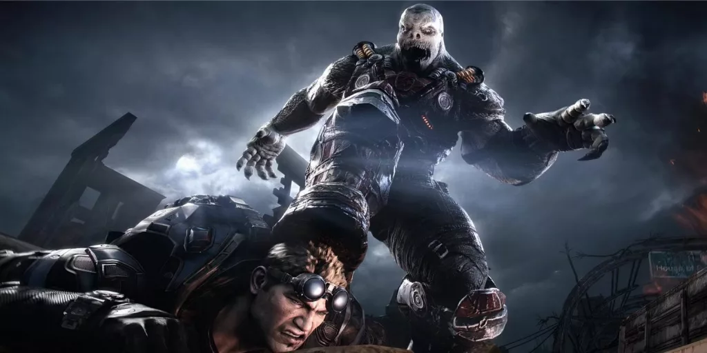 Créature menaçante de Gears of War sur le point d’écraser la tête d’un soldat au sol.